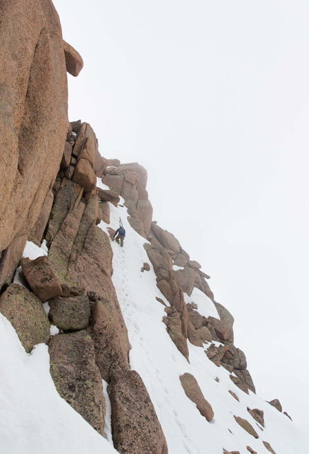 Austin Porzak carefully working his way to the summit of Sunlight. [Photo] Bjorn Bauer