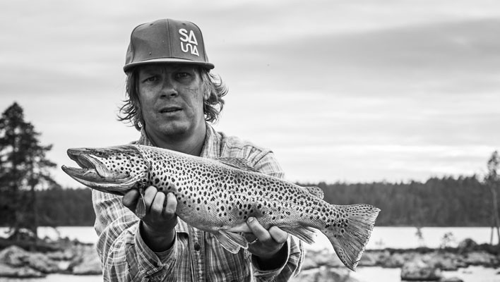 Tero Repo trades SLRs for salmon in Lapland, Finland. [Photo] Arska Saarimaki