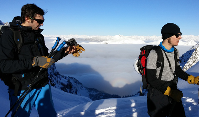 Evan at the top of a skin track with Valhalla Mountain Touring customer Ben Bruno. [Photo] Louise Lintilhac