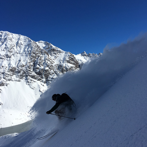 TK conceals the mountainous backdrop with a spray of powder. [Photo] Courtesy McKenna Peterson