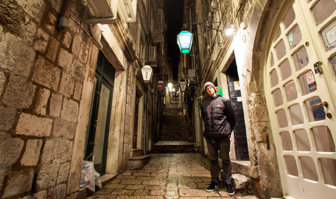 Dylan Hood steps into an old bar in Dubrovnik, Croatia. 